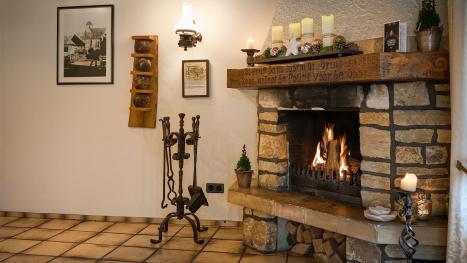 Photo of the fireplace with a fire burning.