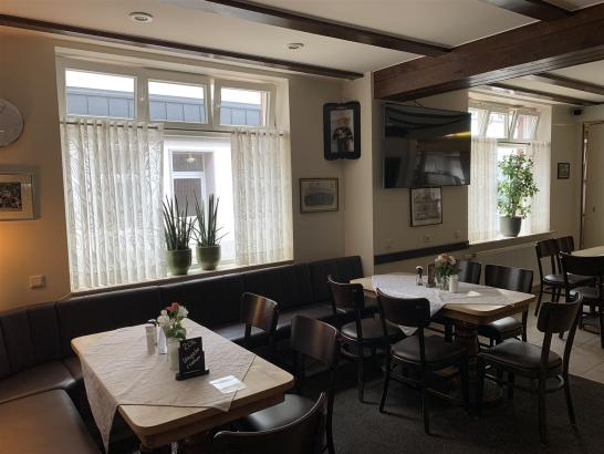 Tables by the window in the café.