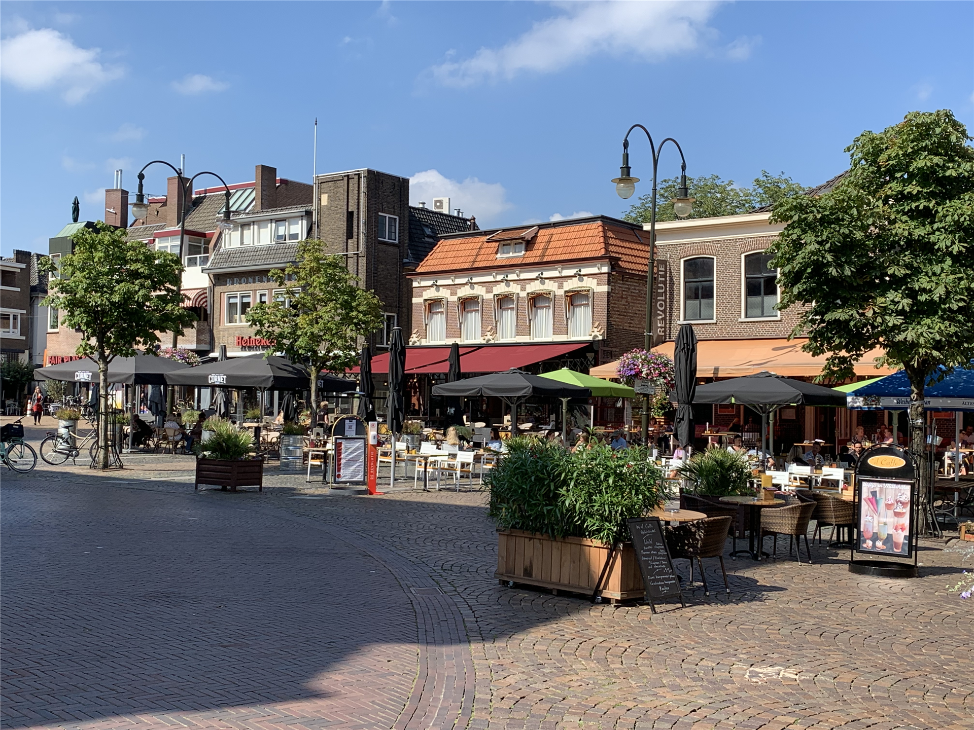 View of the market square in the center of Winterswijk with terraces and restaurants.