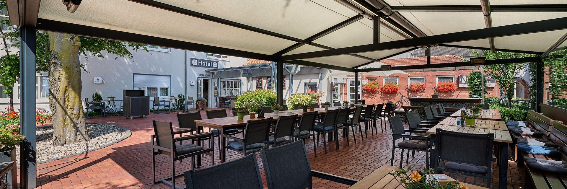 A nice view of the beer garden, with the hotel in the background.