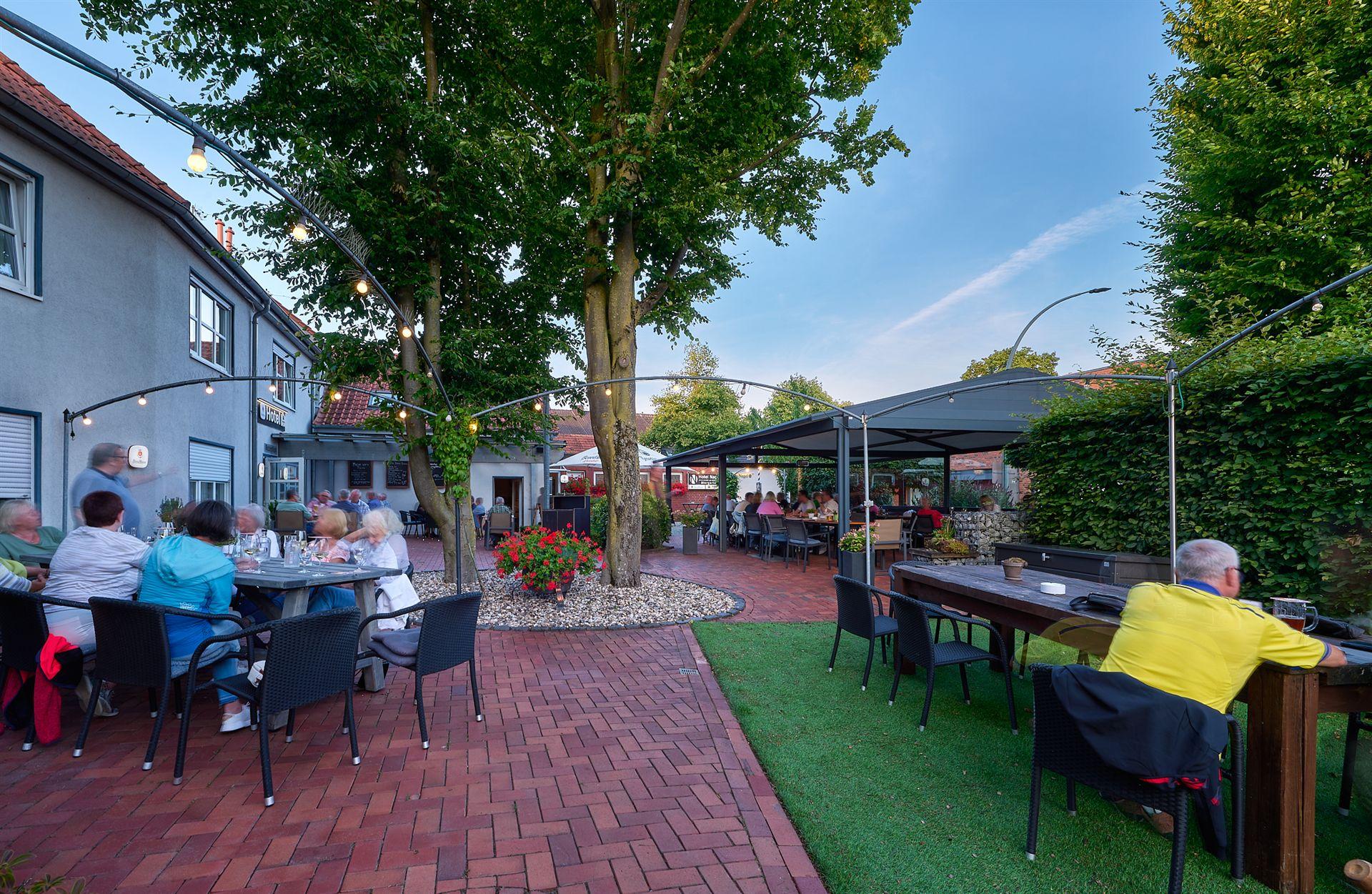 A nice view of the beer garden, with the hotel in the background.