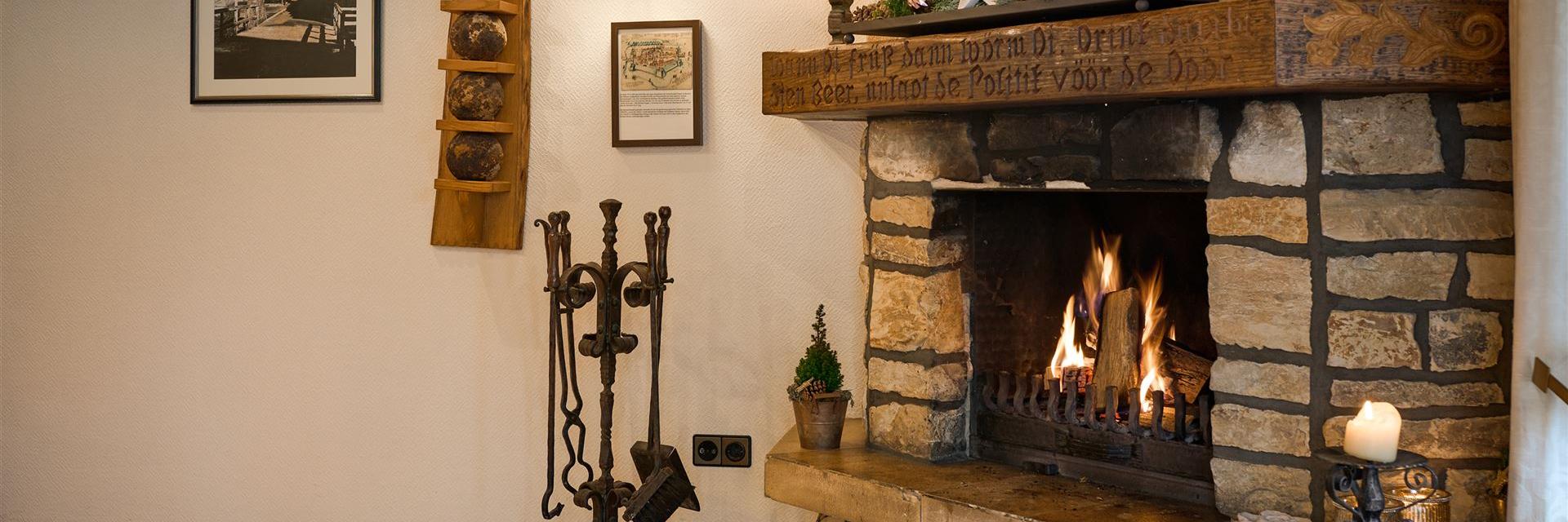 Photo of the fireplace with a fire burning.
