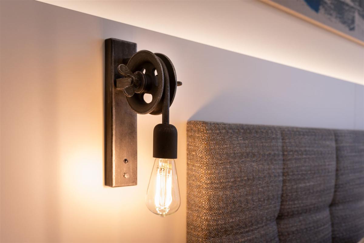 Lit wall lamp in the Comfort Room.