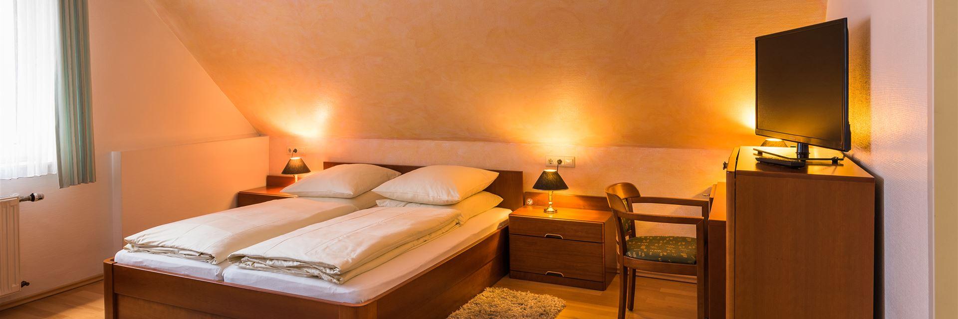 The picture shows an economy double room.